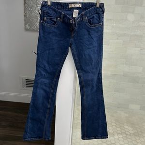 Roxy size 3 dark wash demin jeans. Flare